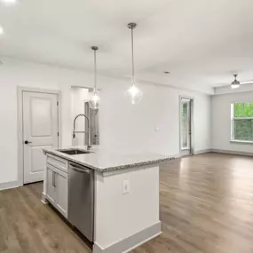 Open concept floor plan with hardwood floors.