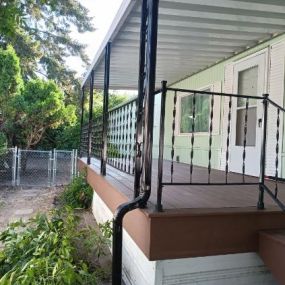 We put in a new framing and composite deck with metal railing on a mobile home at a wonderful ladies house.