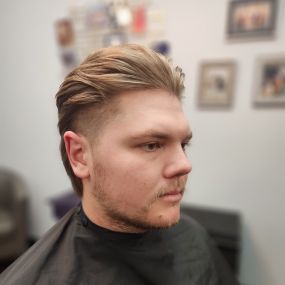 Slicked Back Mullet Haircut With Shaved Sides in Knoxville, TN