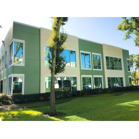 This image showcases the excellent work of PSF Window Tinting, a Tampa-based company, on an office building. The high-quality tinted window film creates a cooler, more comfortable interior for both employees and patrons.