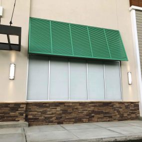 This image showcases a commercial plaza retail space featuring frosted window film for privacy and energy efficiency, expertly installed by Precision Safety Films, PSF Window Tinting.