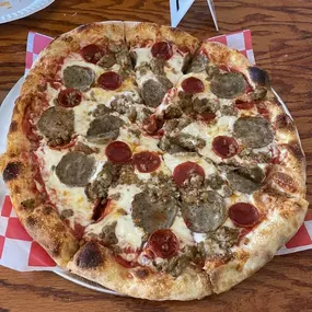 The Carnivore - Pepperoni, italian sausage, and meatball over mozzarella and our house marinara sauce.