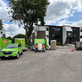 SERVPRO vehicles and equipment on job site.