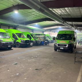 SERVPRO fleet parked inside warehouse.