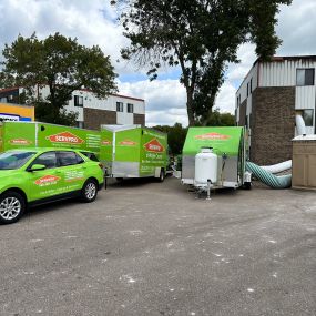 SERVPRO vehicles and equipment on job site.