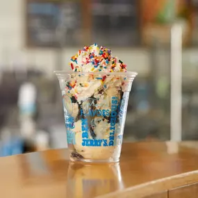 Hot fudge sundae in a cup in a Ben & Jerry's ice cream shop.
