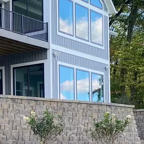 1-800 HydroHot exterior water cleaning that reflects the clouds in the gleaming, glistening, glass.