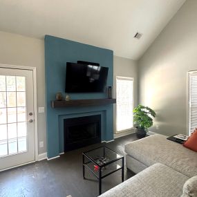Simple but fabulous - this home remodel required an open plan living area, with secluded TV room. Fresh paint, accent wall, new shelving and fire place.