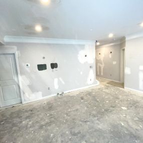 This basement remodel in East Cobb County, Georgia is a project in process to create a full service bar area, complete with custom wood cabinetry, ceiling and wallchiere, wallpaper, and quartz countertops. The perfect spot to build memories.