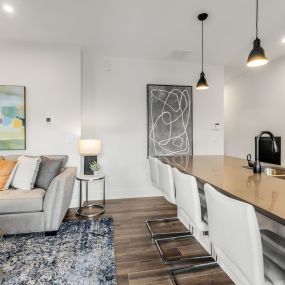 A hearty welcome to your newly renovated home, where you are greated with quartz kitchen countertops new sink and faucet, industrial style pendant lighting, stunning engineered wood flooring, fresh paint, and comfortable furnishings.