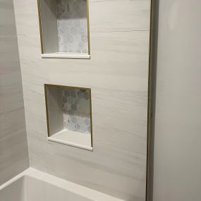 Niche built-in shelves are terrific to get ones bathroom organized - give us a call to remodel your Bathroom.