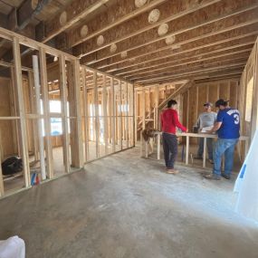 Our team on site discussing next steps to complete the framing on this new build house in Sandy Springs Georgia