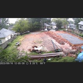 Forming the foundation with lumber, after all plumbing and electrical conduit has been installed in the ground.