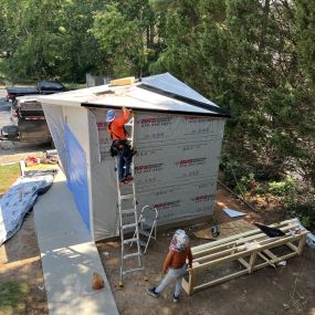 Backyard Studio l with metal roofing installation. Electrical connection is the responsibility of the homeowner before construction.