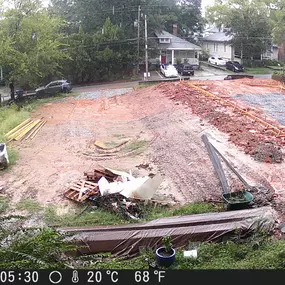 Forming the foundation with lumber, after all plumbing and electrical conduit has been installed in the ground.