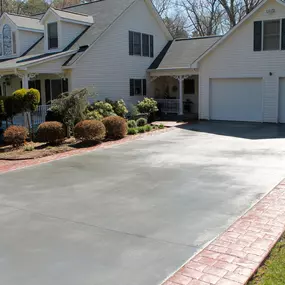 Before pouring any new concrete residential driveway, proper grading is essential to prevent water pooling on the finished driveway. We create a slight slope to facilitate drainage, directing water away from your home and into appropriate drainage systems.