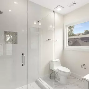 Beautiful bathrooms in multifamily apartments nestled in midtown Atlanta, with sleek white tiles, create a clean aesthetic. White fittings, from elegant sinks to modern faucets, add a touch of sophistication, allowing the room to feel airy and spacious.