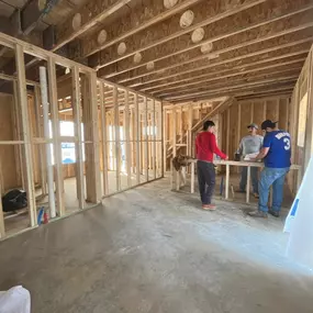 Our team on site discussing next steps to complete the framing on this new build house in Sandy Springs Georgia