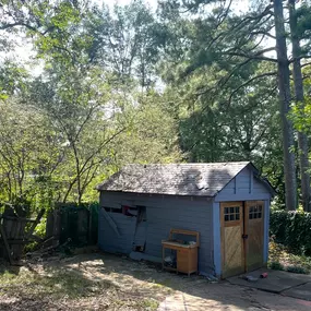 Fallen tree limbs on this shed and fence are a consequence of Hurrican Helene sweeping through Georgia. We are quoting on doing the repairs for this Cumming homeowner.