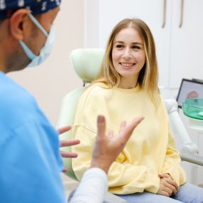 Dentist speaking with a patient