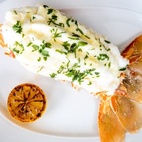 SOUTH AFRICAN COLD-WATER LOBSTER TAIL butter finished & carved tableside
