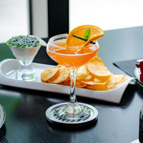 HIGH FLIER bourbon, aperol, mandarin orange-lime syrup, lemon juice, splash of bubbles