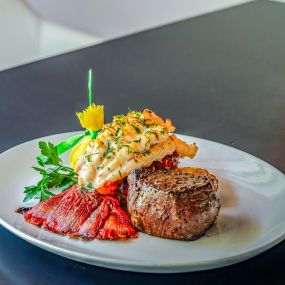 COLD-WATER LOBSTER TAIL & BEEF TENDERLOIN FILE butter finished & carved tableside