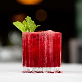 SPICY BLACKBERRY MARGARITA tequila, orange liqueur, blackberry purée, habañero-lime syrup.