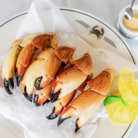 FRESH STONE CRAB CLAWS Served fresh and never frozen, these sweet, meaty claws are pulled from the traps and arrive at your table chilled, pre-cracked, and with our house specialty mustard sauce. All in less than 24 hours.