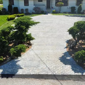 Broken concrete driveway upgraded with concrete paver overlay