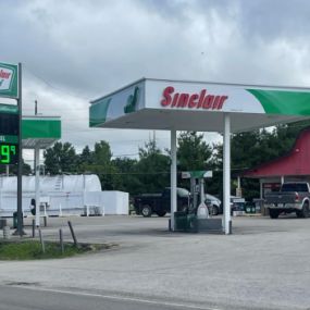 Sinclair gas station fueling island and sign