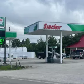 Sinclair gas station fueling island and sign