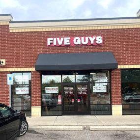 Exterior photograph of the Five Guys restaurant at 26401 Novi Road in Novi, Michigan.