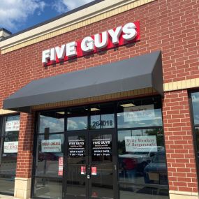 Exterior photograph of the Five Guys restaurant at 26401 Novi Road in Novi, Michigan.