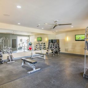 24-hour fitness center with free weights and cardio machines.