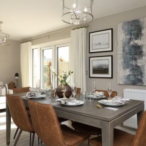 The Windsor show home dining area interior at Crest Nicholson at Malabar