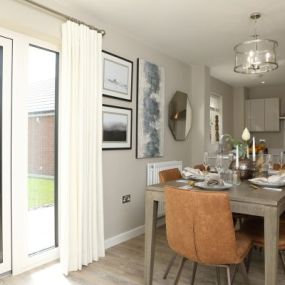 The Windsor show home dining area interior at Crest Nicholson at Malabar