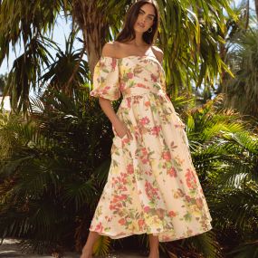 Gorgeous, floral jacquard midi dress. Style features off off-shoulder neckline with voluminous balloon sleeves. Form fitted bodice with beautiful drape and full volume skirt. Bustier construction inside. Fully lined except sleeves. Hidden back zipper.