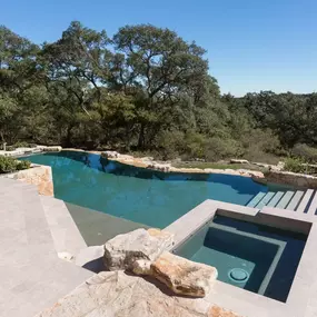 A mid-century modern pool in an organic environment: