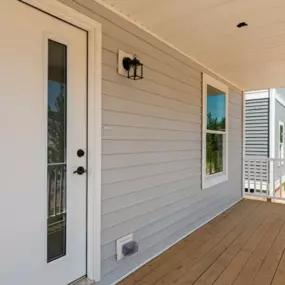 The porch area at Belle Meadow Homes offers a charming space to relax and unwind.