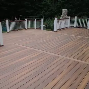 Composite Deck with white railings, built by Decks by Murray