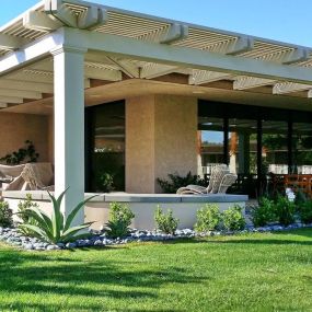 Alumawood pergola installed around corner of custom home on golf course