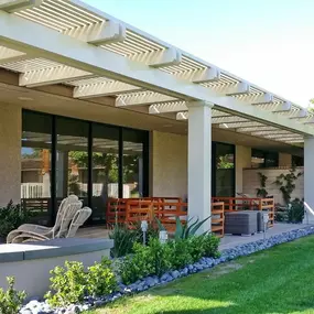 Double beam Alumawood trellis cover over a Beautiful backyard patio area.