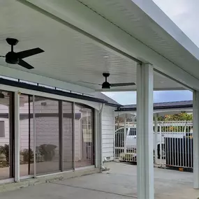 Roof mounted Newport Alumawood patio cover with fans.