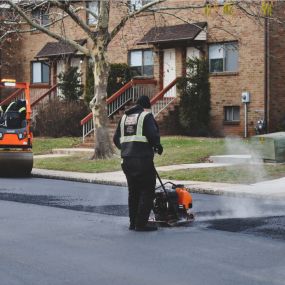 Chamberlain Contractors employee using a melter