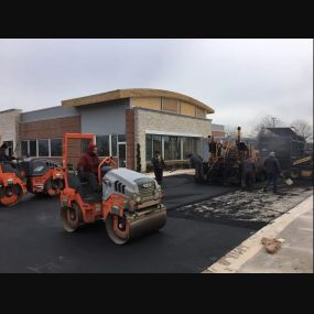 Chamberlain Contractors employees repaving at a job site