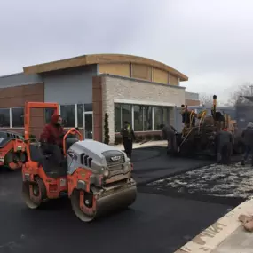 Chamberlain Contractors employees repaving at a job site