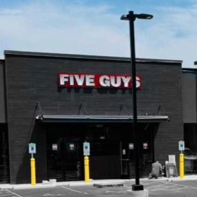 Exterior photograph of the Five Guys restaurant in Grafton, Wisconsin.