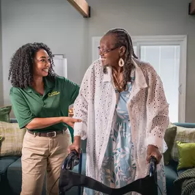 Home Instead Care Giver and their client in a lounge