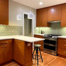 Full Kitchen remodel in Sleepy Hollow: custom cabinetry, tile work, quatrz countertop, floating shelves, modern lightning & floor refinishing